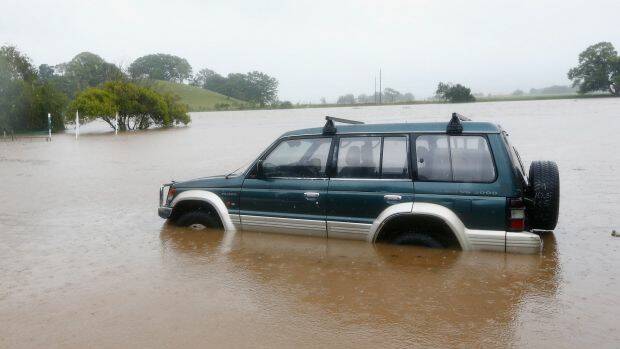 A car is trapped in the floods in Murwillumbah. Photo: Getty Images
