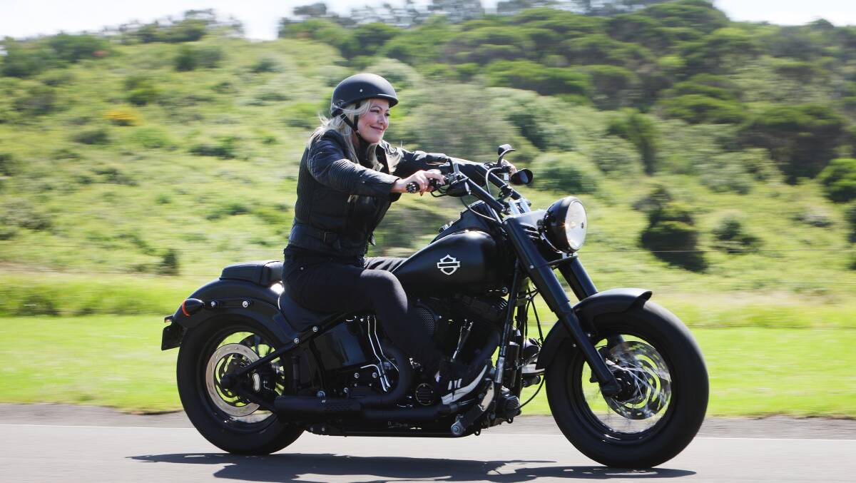 Riding her motorcycle along twisty, country roads puts a smile on Sandy's face.