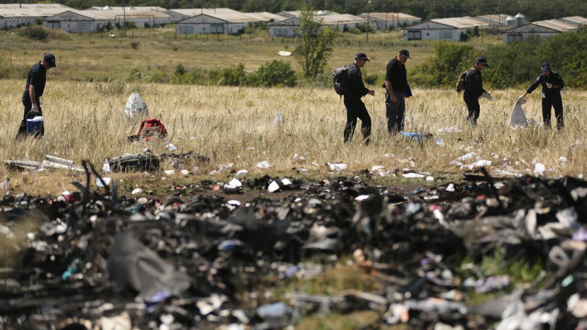 Australian Federal Police and their dutch counterparts searching at the MH17 crash site. Picture: Kate Geraghty