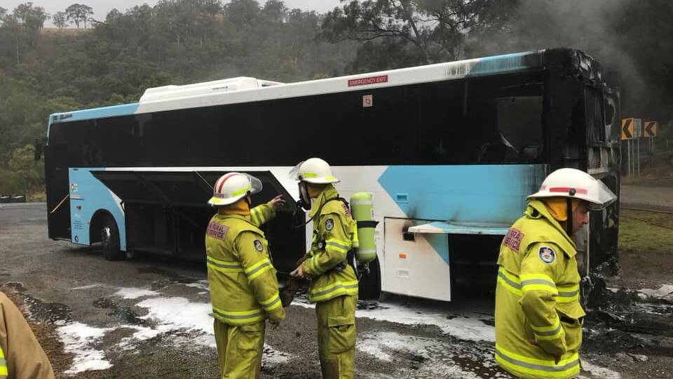 Bus catches alight at the bottom of Macquarie Pass