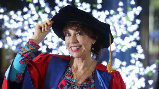 Kathy Lette receiving her honorary doctorate at the University of Wollongong this month. Photo: Robert Peet
