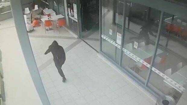 CCTV shows the moment an unidentified killer fatally shot Walid Ahmad at Bankstown Central shopping centre.  Photo: Supplied
