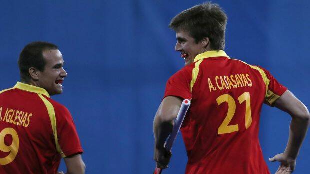 Goal hero: Spain's Alex Casasayas, right, smiles with teammate Alvaro Iglesias. Photo: AP
