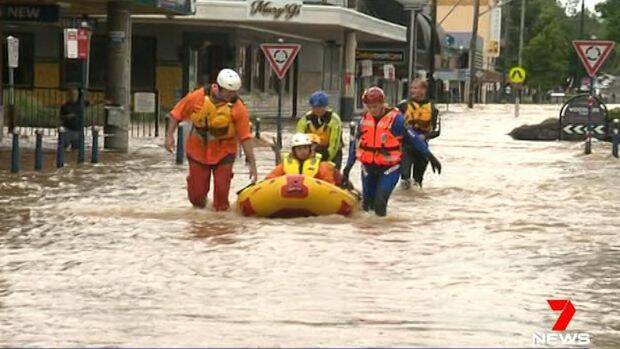 A man is rescued by SES swift water crews in Lismore. Photo: Seven News
