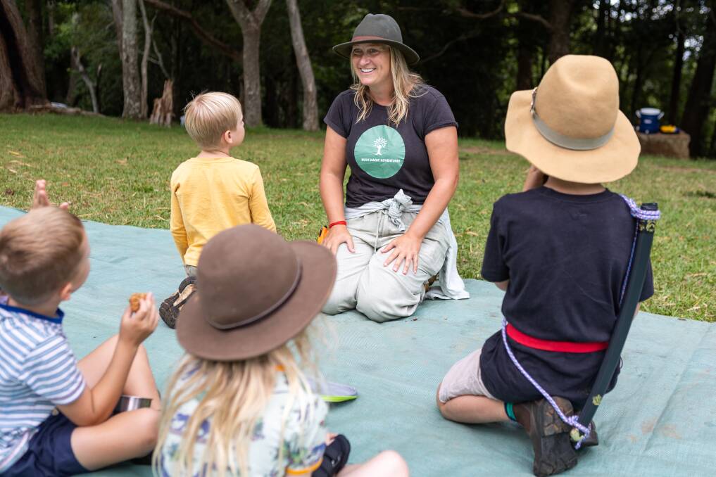 Bush Magic Adventures co-founder Katrina Venables sits down with a group of preschoolers. 