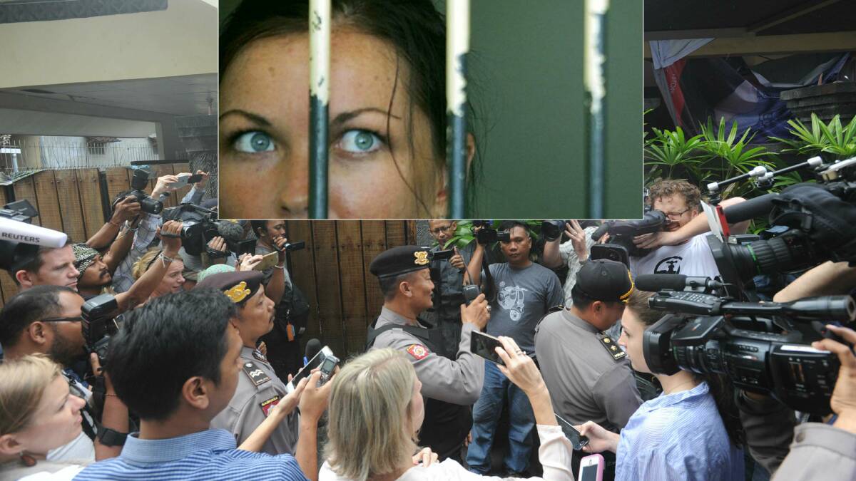 A media scrum forms outside Schapelle Corby's Denpasar compound in Bali. Police arrive to inspect the scene. Photo: Alan Putra
