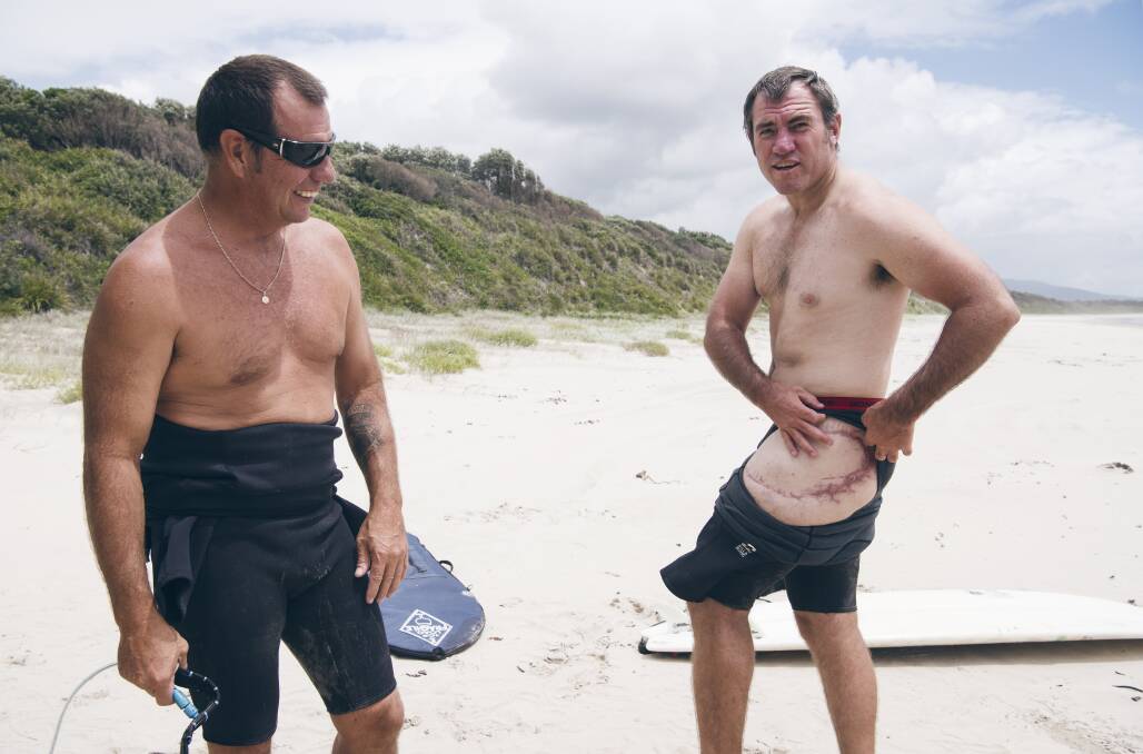 Dave Pearson (at left) with fellow shark attack survivor Dale Carr. Photo: James Brickwood