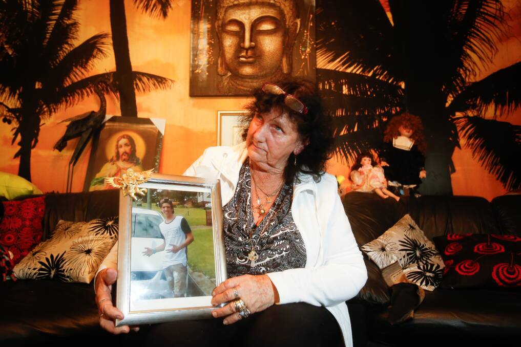 Kathy McWatters holding a framed photograph of her slain grandson Jye. Picture: Adam McLean