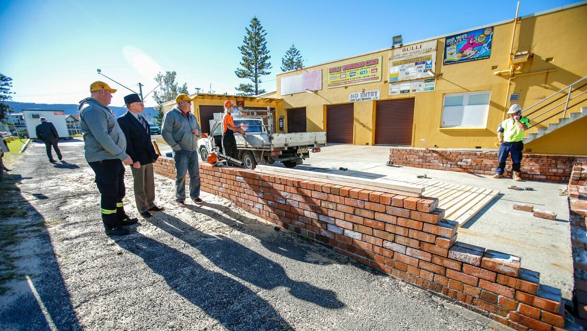 Under construction: Bulli surf club's Scott Gordon and Keith Caldwell with Lord Mayor Gordon Bradbery look on as work gets underway. Picture: Adam McLean.