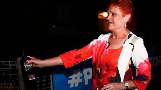 Pauline Hanson departs with a bottle of Bundaberg Rum. Photo: Alex Ellinghausen

