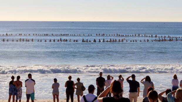 Local surfer Marc Leabeater, also known as Eggy, was farewelled with a paddle out in December last year. Photo: Drew Camilleri, Still Moments