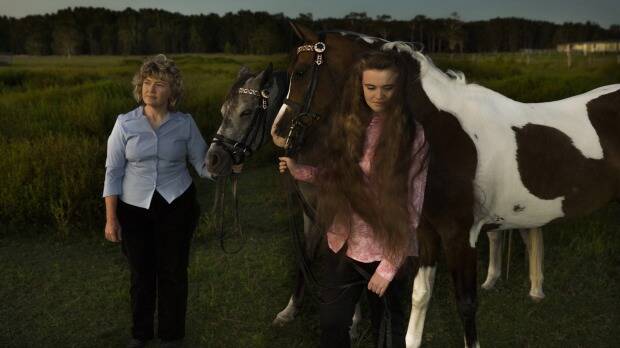 Kim-Leanne King, with her youngest daughter Madeline and their Appaloosa horses, worries she exposed her children to poison. Photo: Nic Walker