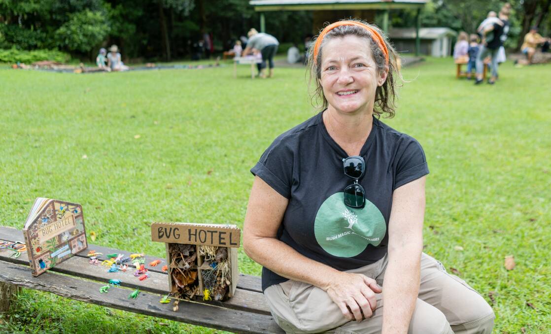 Co-founder Simone Potter sits next to a bug hotel at the Girl Guides camp.