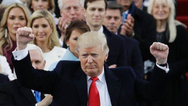President Donald Trump pumps his fist after delivering his inaugural address. Photo: AP
