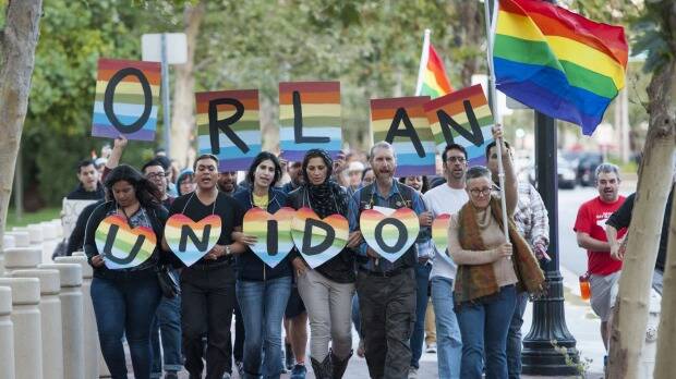  Several hundred gay rights activists march in Santa Ana, California in supports of the victims of the Orlando massacre. Photo: Kevin Sullivan/The Orange County Register/AP