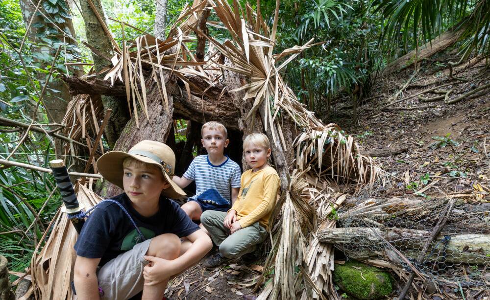 Six-year-olds Hugo, George and Ned build a hut at Bush Magic Adventures. Pictures by Adam McLean