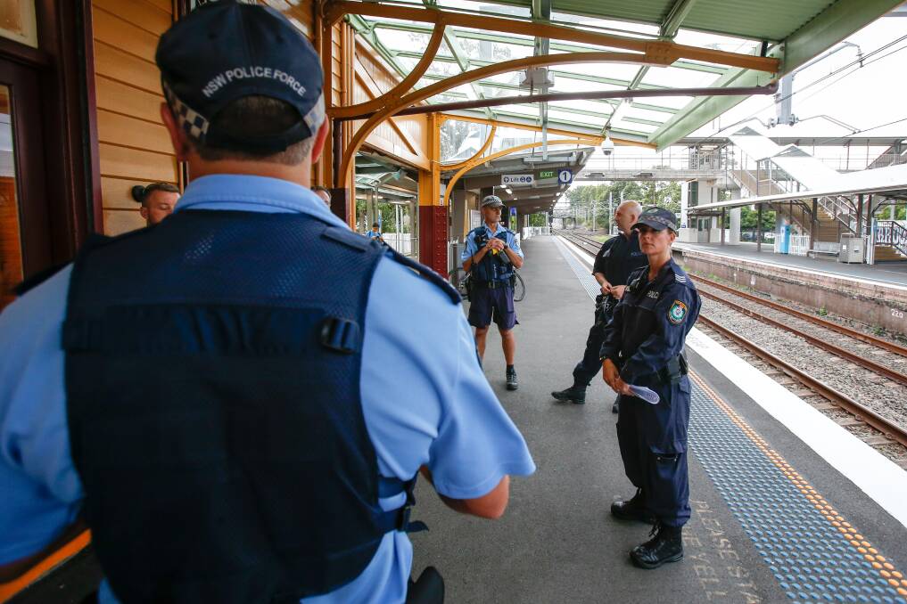NSW Police officers at Thirroul train station for a police operation targeting transport offences. Photos: Adam McLean