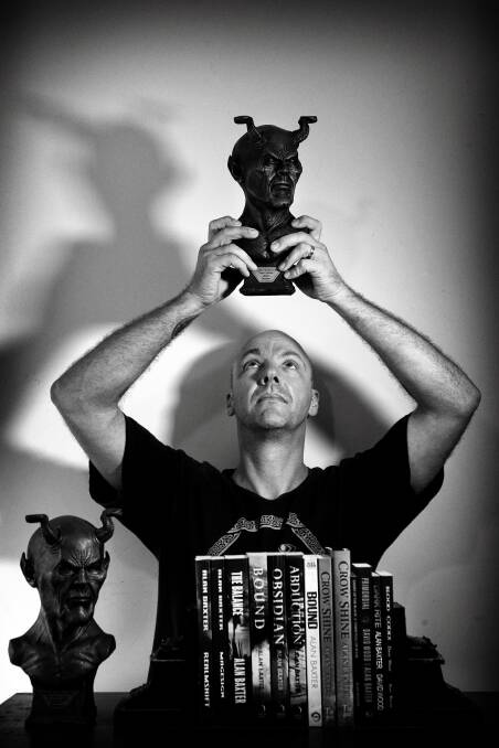 The author with two of his Shadows Awards. Run by the Australian Horror Writers Association, they are annual awards dedicated solely to horror and dark fiction. 