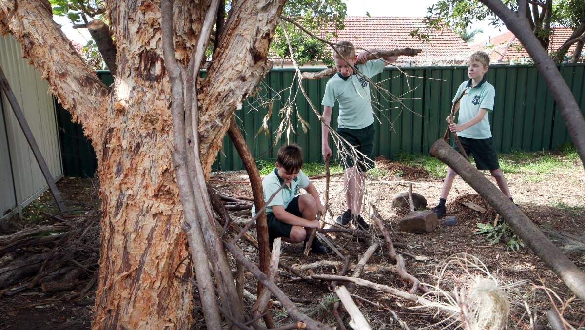 An area of the playground has been designated the Stick Construction Zone and piles of branches are always at the ready. 