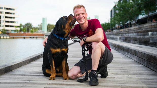 Jarrad Houghton with his dog Basil came to the rescue of a child that fell into the lake at Kingston Foreshore. Photo: Dion Georgopoulos
