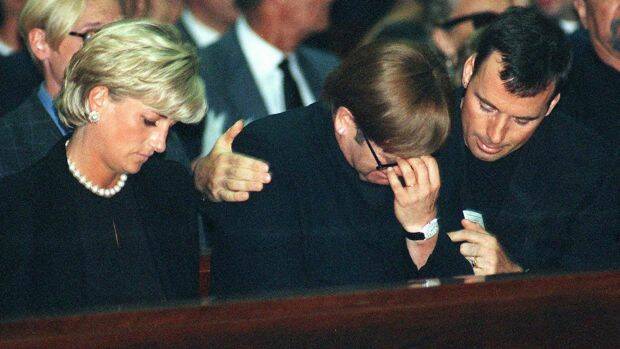 Diana, Princess of Wales, and British pop-star Elton John being comforted by his companion at the memorial mass for Gianni Versace in 1997. Photo: Luca Bruno
