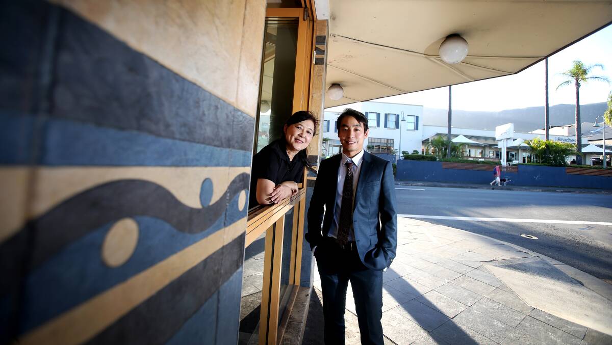 Food World on Keira Street has been dishing up Asian delights for years. Now, they're expanding to Thirroul with a new Asian fusion outlet and new menu. Co-owner Yen Phan is excited with Michael Li. Picture: Sylvia Liber