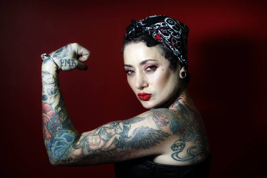 Sue Maffullo poses for Illawarra Mercury photographer Sylvia Liber's photo essay on heavily tattooed Illawarra women. 