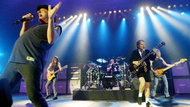 AC/DC performing in Munich in 2003. From left, Brian Johnson, Malcolm Young, Phil Rudd, Angus Young and Cliff Williams. Photo: AP
