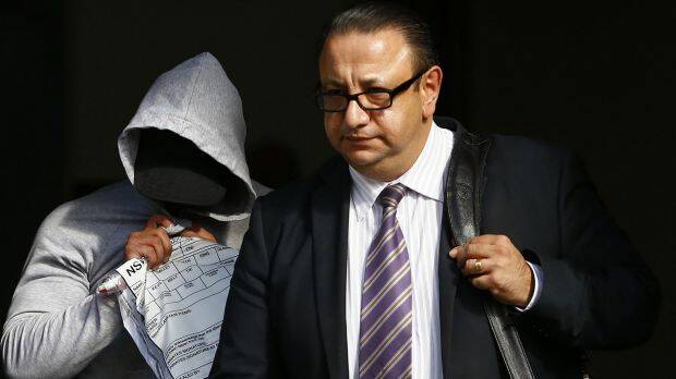Mohammed Alameddine, left, leaves Bankstown Local Court with his lawyer Elias Tabchouri in April. Photo: Daniel Munoz
