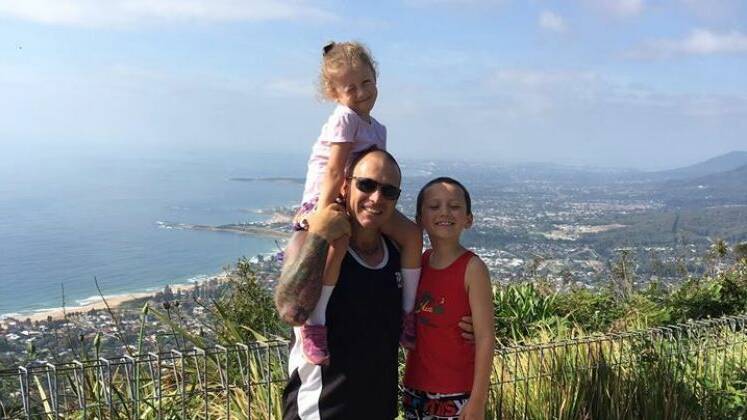 Steve Jenner with children Rory and Maddy at the Sublime Point lookout in the Illawarra. Photo: Supplied

