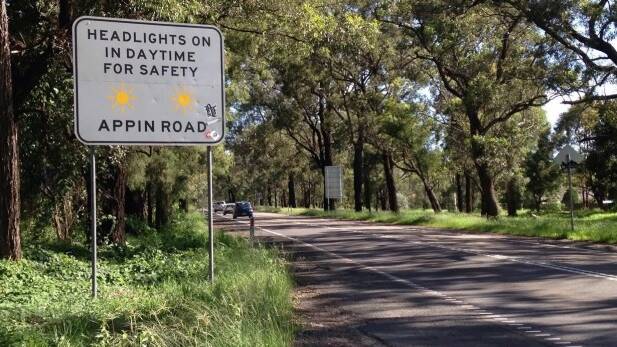 Drivers are instructed to leave headlights on in daytime for safety at the beginning of Appin Road. Photo: Saskia Mabin