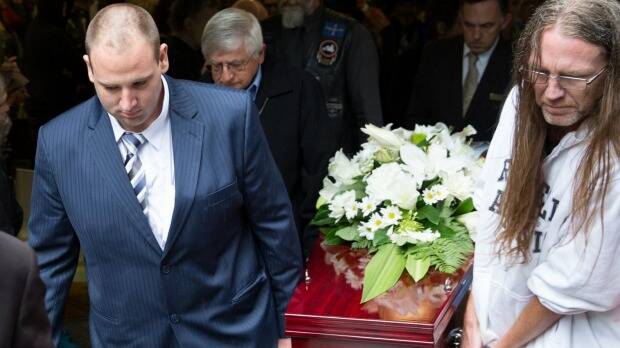 Anthony (at left) and Dave carry out Sallie's coffin. Photo: Janie Barrett