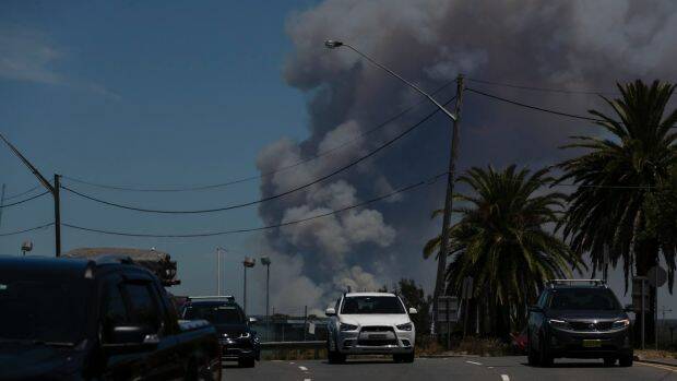 The fire at the Royal National Park viewed from Captain Cook Bridge on Saturday. Photo: Brook Mitchell

