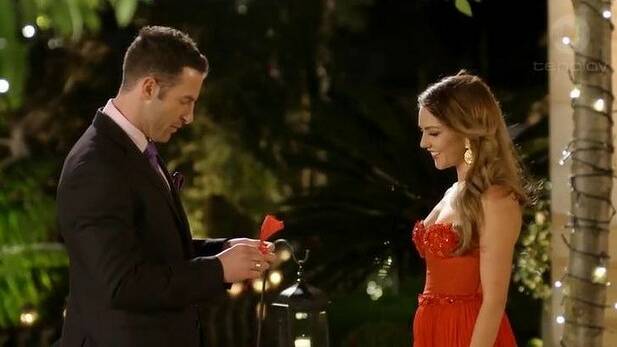Sasha whipping up a napkin rose for Sam Frost. Photo: Ten