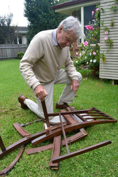 Retired Rear Admiral Neil Ralph surveys the damage to a chair, broken during Wednesday morning’s break-in and altercation with a male intruder.