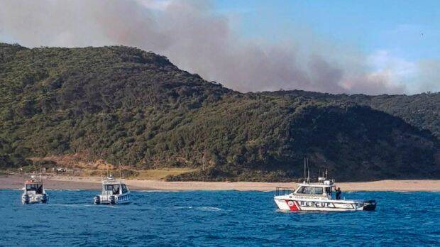 Boats off Garie Beach to evacuate people. Photo: Marine Rescue NSW
