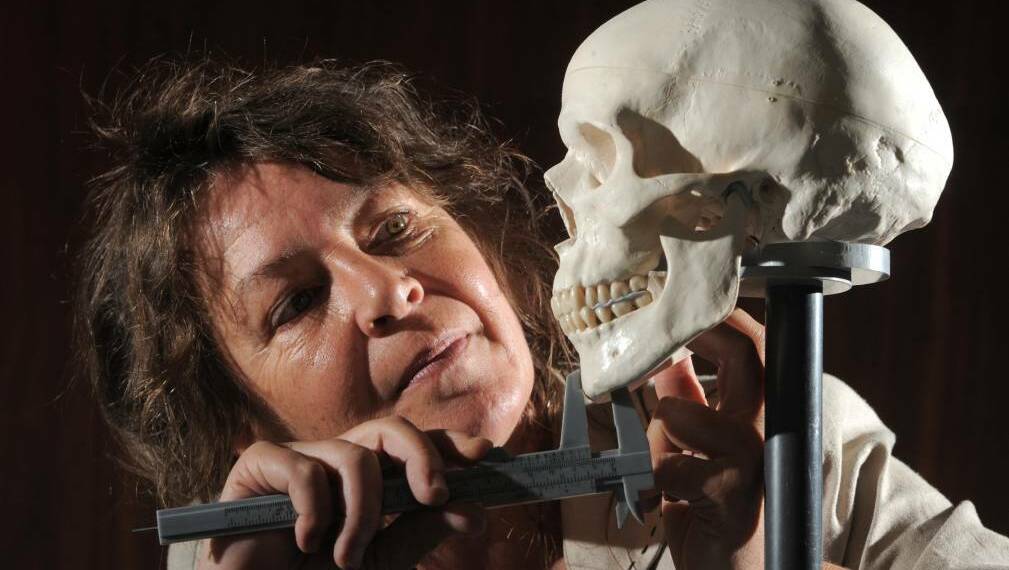 Dr Susan Hayes with the replica skull she uses to teach facial anthropology. Pictures: GRAHAM TIDY