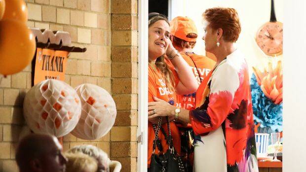 Pauline Hanson consoles a distressed supporter. Photo: Alex Ellinghausen

