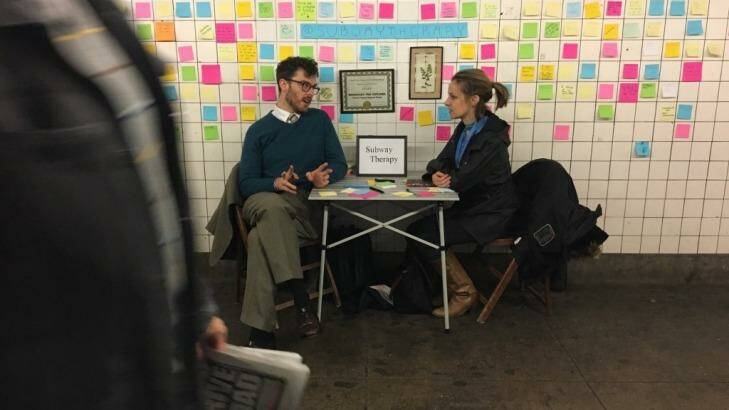 Sam Lane sits with Matthew 'Levee' Chavez, the creator of Subway Therapy, near Union Square.