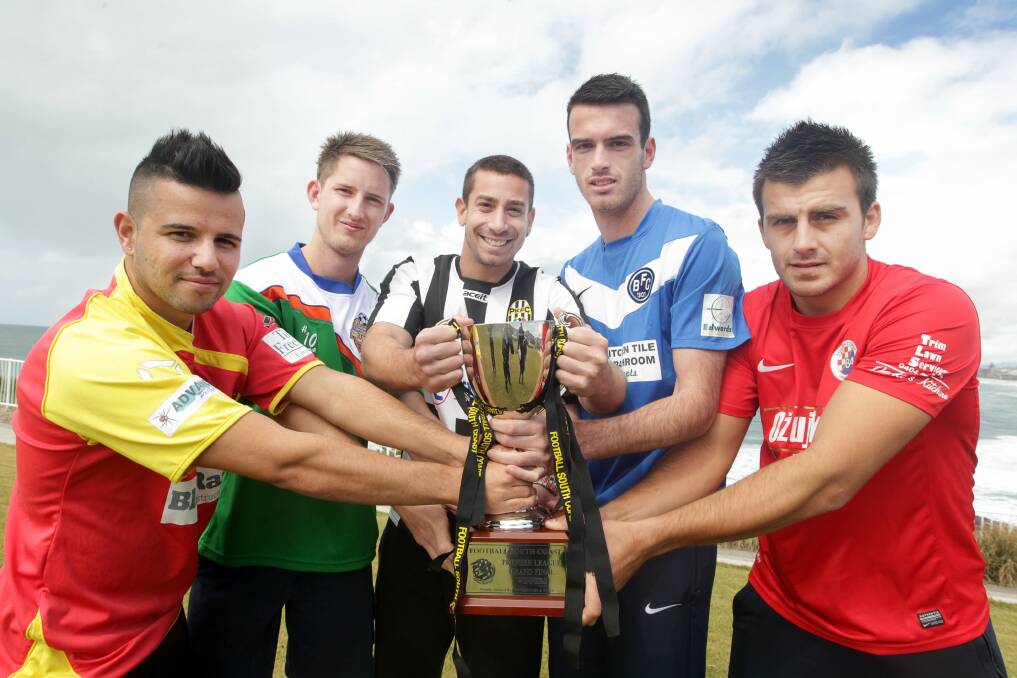 John Martinoski of Wollongong United, Ryan Suttle of Dapto Dandaloo, Nuno Pires of Port Kembla, Ben McGuiness of Bulli and David Stojic of South Coast United all have a hand on the IPL finals trophy. Picture: SYLVIA LIBER