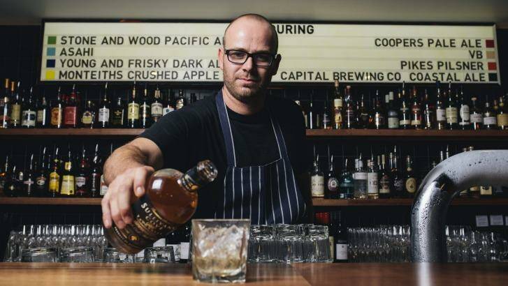 Owner Nick Parkinson behind the bar at Gungahlin's newest venue, Young and Frisky.  Photo: Rohan Thomson
