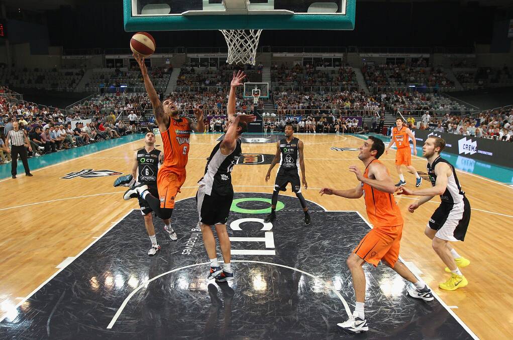 On fire: Cairns Taipan Scott Wilbekin takes a shot against Melbourne United last week. Picture: GETTY IMAGES