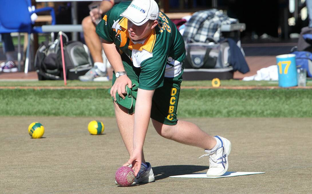 Dapto Citizens teenager Jordan Taylor plays his bowl during the opening round of the Illawarra open singles at Wiseman Park. Taylor won two rounds, before being beaten by Albion Park's Roger Duggan who has reached the quarter-finals. Picture: GREG TOTMAN