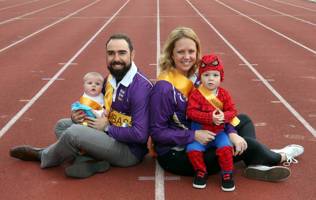 Luke and Katie Rollinson with their children, Harper and Eli. The Rollinsons and Sister’s Cancer Support Group are this year’s ambassadors for the Wollongong Relay for Life. Picture: KIRK GILMOUR