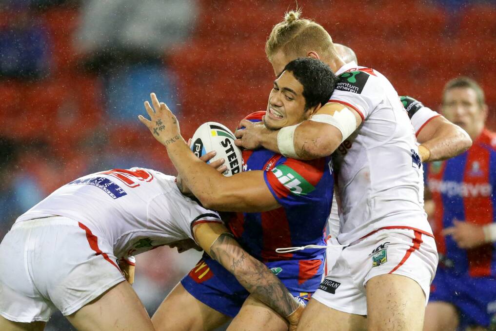 The Dragons muscle Sione Mata’utia into touch.  Picture: JONATHAN CARROLL