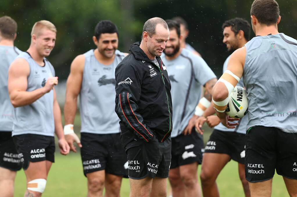 South Sydney coach Michael Maguire shares a laugh with his players at training.Picture: GETTY IMAGES