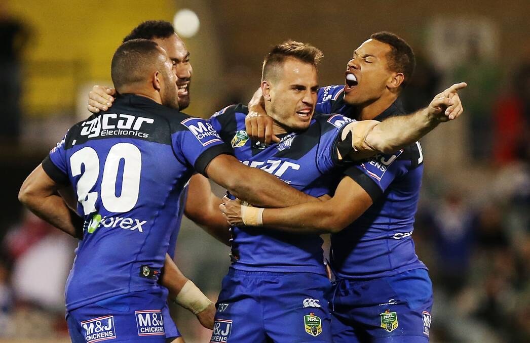 Josh Reynolds of the Bulldogs celebrates with teammates after kicking a field goal against Canberra. Picture: GETTY IMAGES