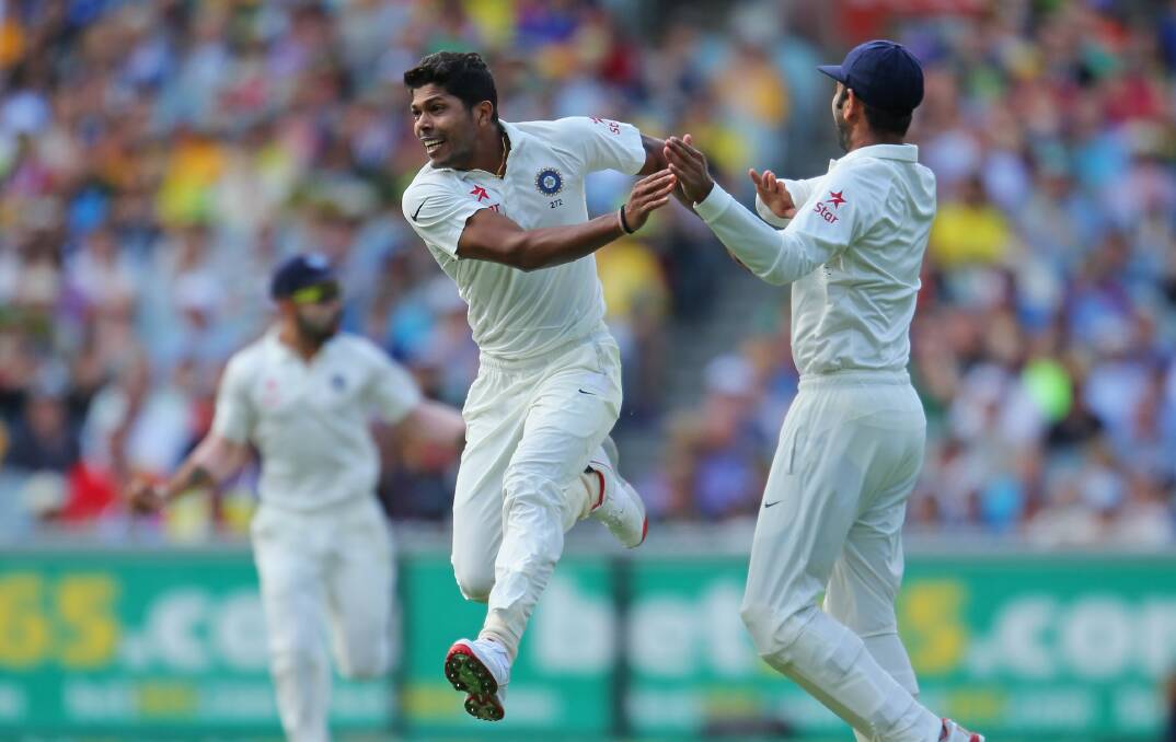 Umesh Yadav celebrates taking the wicket of Australian opener David Warner for a duck in the Boxing Day Test at the MCG. Australia were 5-259 at stumps on the first day. Picture: GETTY IMAGES