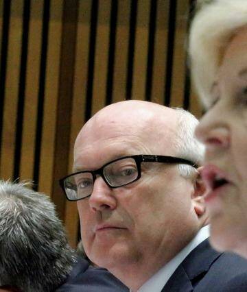Attorney-General Senator George Brandis and Professor Gillian Triggs, President of the Human Rights Commission, during a Senate hearing at Parliament House in Canberra on Tuesday. Photo: Alex Ellinghausen