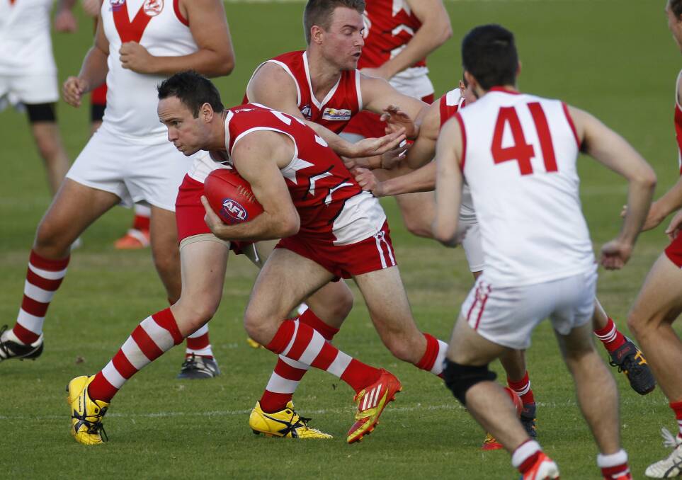 Peter Lloyd emerges from a ruck with possession for the Illawarra Lions on Saturday. Picture: ANDY ZAKELI